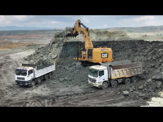 Cat 6015b excavator loading trucks with two passes sotiriadis brothers