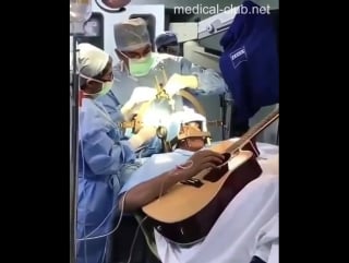 An indian musician played the guitar on the operating table to help doctors treat involuntary muscle spasms in his fingers