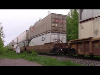 Cn es44ac 2825 leads cn stack train 121 at berry mills, nb (june 2, 2015)