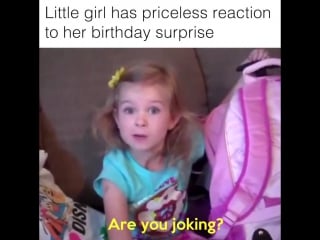 Cute little girl cries from happiness on her birthday