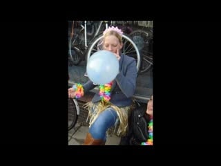 Smoking girl blow to pop balloon and gets cheered