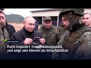 Putin inspiziert truppenübungsplatz und zeigt sein können als scharfschütze