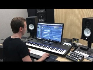 Andrew rayel working in the studio on a new track