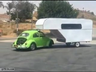 Vw beetle with trailer turns around
