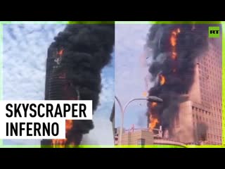 Huge fire engulfs office tower in china