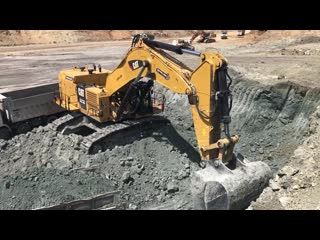 Cat 6015b excavator loading trucks with two passes sotiriadis brothers