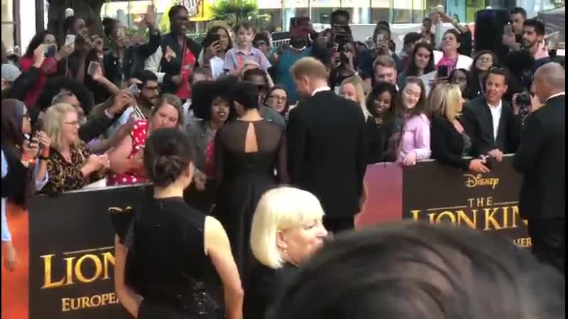 The duke and duchess of sussex have been spotted talking with fans at the european premiere of the lion king