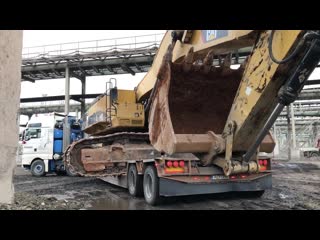 Cat 385c loading and transporting by side fasoulas heavy transports