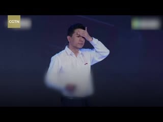 Baidu ceo robin li drenched on stage during company speech