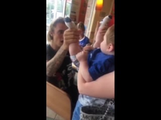 Another fan taken video of justin with a baby in nanuet, new york august 5