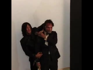 Norman reedus smearing cake on andrew lincoln’s face