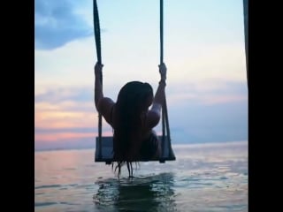 Sunset swing in gili island, indonesia
