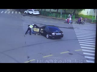 Chinese policeman stops driverless car after it