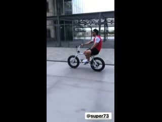 Video former arsenal now vissel kobe forward lukas podolski cruising around on a bike wear