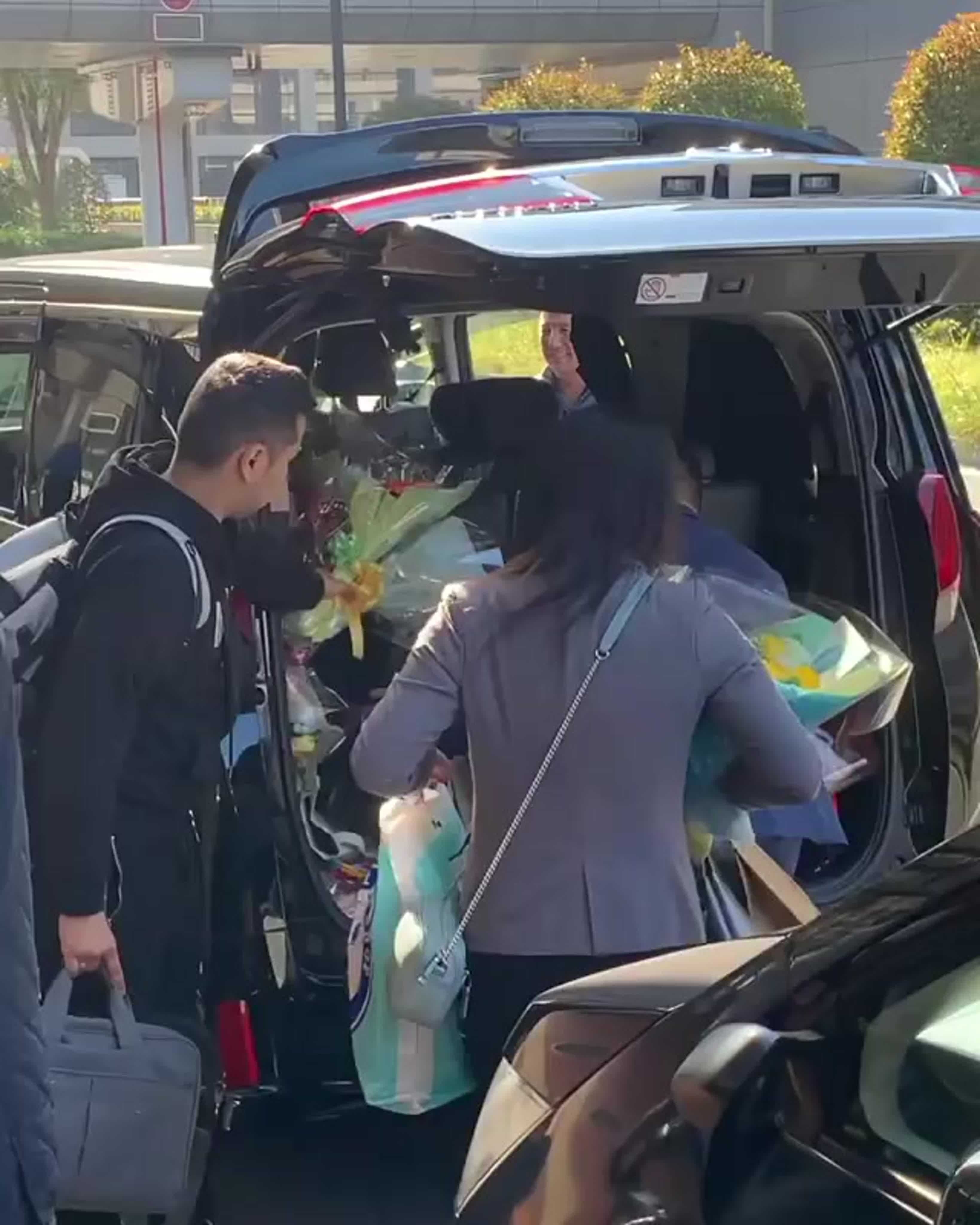 A woman looking directly into the camera with a playful and suggestive smile