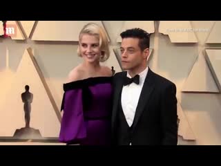 Love doves! rami malek and lucy boynton embrace at 2019 oscars