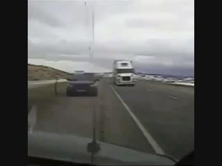 Wind topples 18 wheeler onto a cop car luckily the officer wasn’t in it at the time and no one was hurt