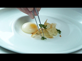 Molecular gastronomy reverse spherified poached egg with idiazabal cheese