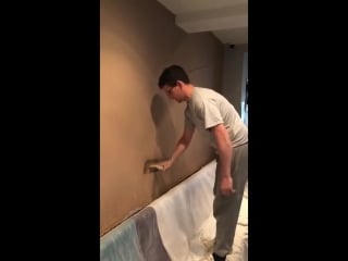 Lads plastering the wall in a pub go for a beer after