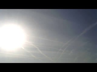 Chemtrails bombardment ariel aerosol spraying via aircraft morning sky mess