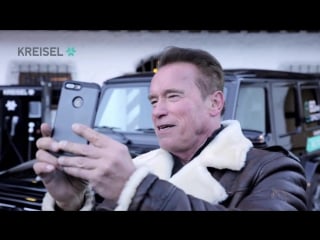 Arnold schwarzenegger präsentiert kreisel electric g klasse