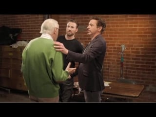 Robert downey jr and chris evans try to make stan lee choose a side