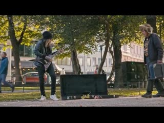 Alexi laiho playing guitar on the street