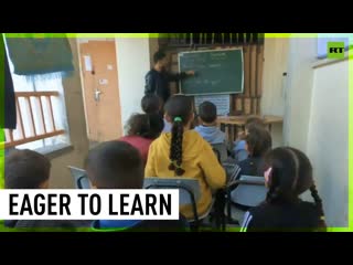Displaced palestinian porn study in makeshift classroom in rafah