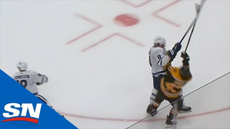 Torey krug shaken up after taking massive hit from jake muzzin