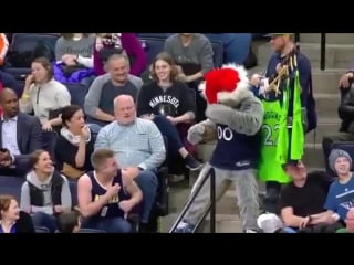 Timberwolves mascot takes denver nuggets fan jersey and he remains shirtless