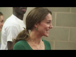 The duchess of cambridge takes to the racetrack and tries her hand at sparring during a visit to the london stadium in stratford