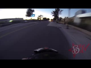 Dude on a motorcycle puts an "i don't stop for cops" sticker on a cop car &amp; flees