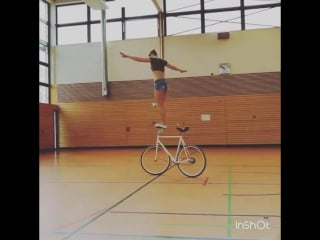 Girl spinning on bicycle handlebars