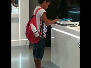 An electronic store in the mall allows a porn to use their tablet for school homework because he doesn't have internet access at
