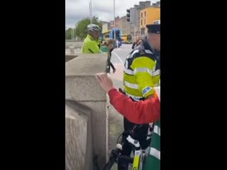 Gardaí arresting an irish woman after blm decided to interrupt a peaceful protest