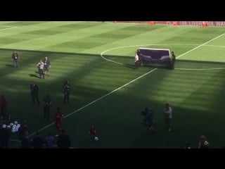 Lovely scenes at anfield as mohamed salah's daughter is cheered by supporters each time she kicks a ball about