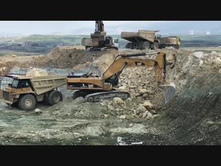 Two cat 385c excavators loading dumpers sotiriadis brothers