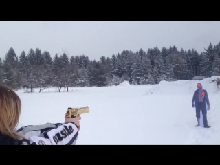 Girl shoots desert eagle slow motion