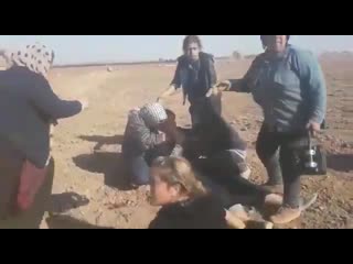 At least one woman was shot dead by turkish troops in kobani