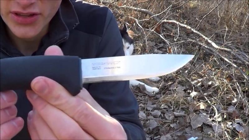 Mora bushcraft survival knife baton, shaving, and starting a fire