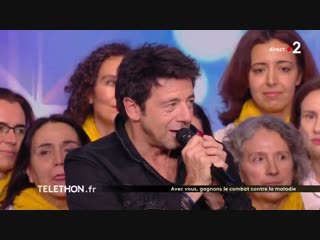 Patrick bruel alors regarde avec groupe la poste pour le téléthon