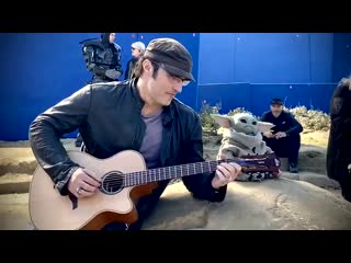 Robert rodriguez hanging out with baby grogu/yoda on the set of the mandalorian