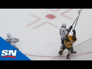 Torey krug shaken up after taking massive hit from jake muzzin