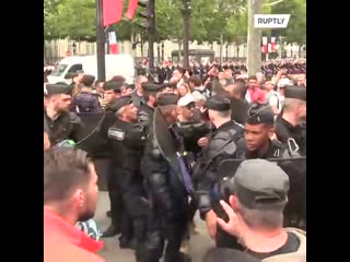 Commotion erupts at anti gov demo as macron arrives for bastilleday celebrations paris france