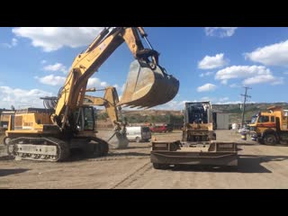 Loading the liebherr 964 by side fasoulas heavy transports