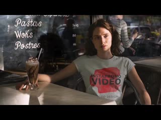Pretty girl using a round neck t shirt cinemagraph while at a bar a13537 mp4