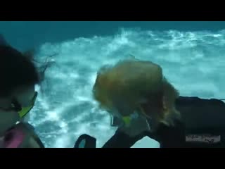 2 girls scuba in pool