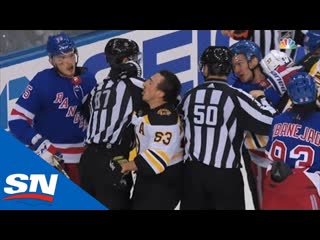 Brad marchand receives helmet popping cross check from pavel buchnevich