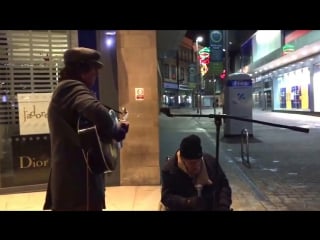 Homeless man joins busker for spontaneous new years eve street jam, the result is incredible