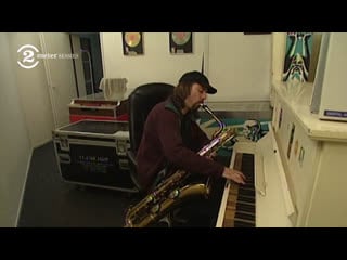 Dana colley plays the piano and sax at the same time